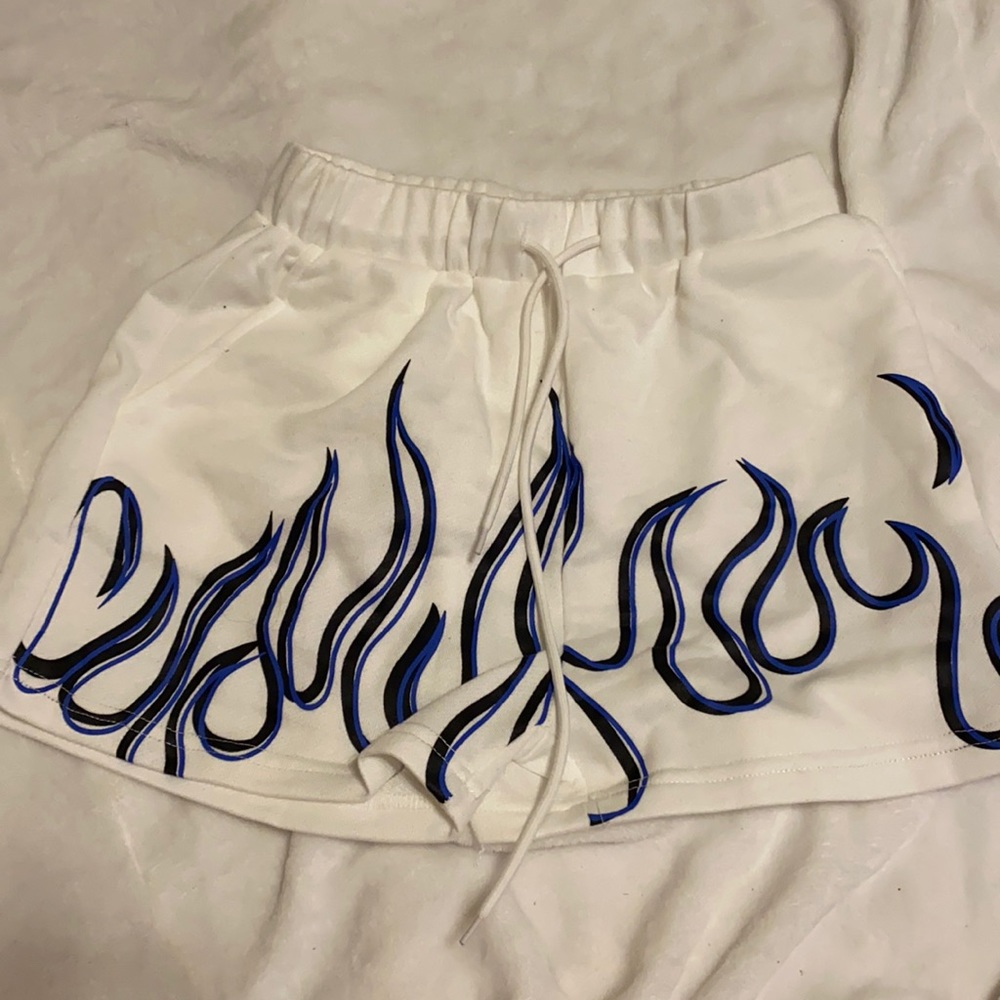 Athletic shorts white with blue and black flame outlines